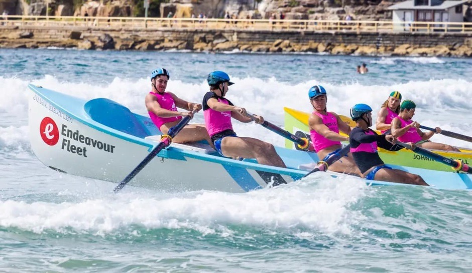 Cronulla SLSC surf boat crew with Endeavour Fleet Management sponsorship branding