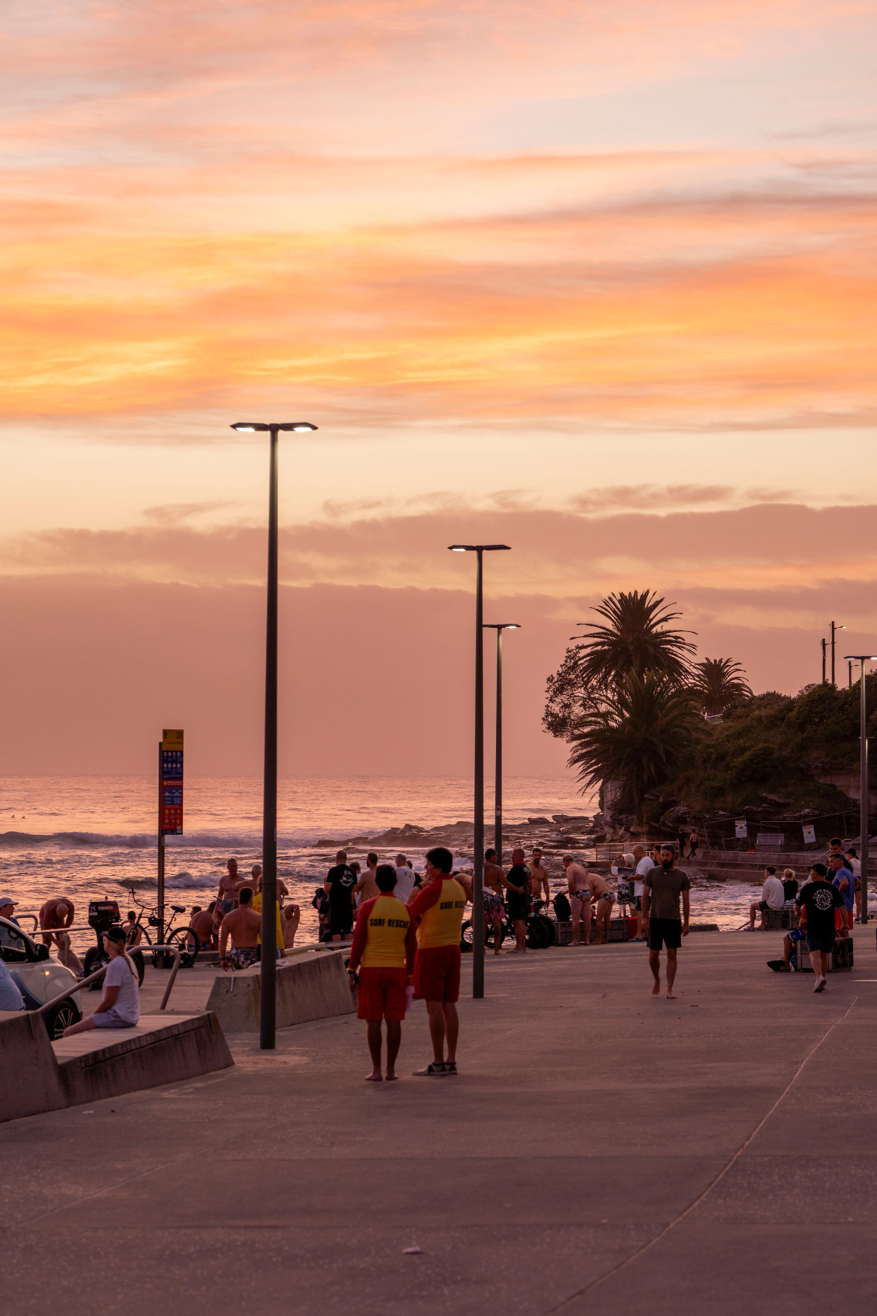 Cronulla SLSC surf lifesavers on the promenade at sunset